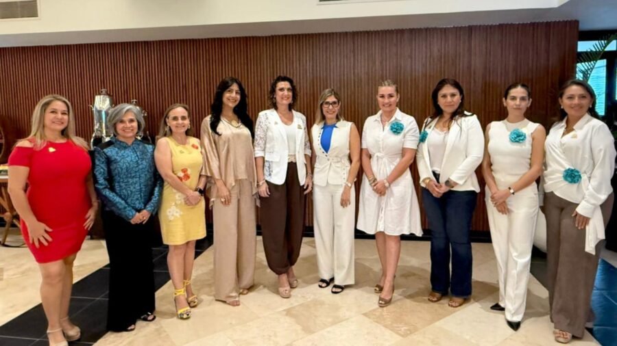 Members of AMEXME Riviera Maya gather for their monthly meeting celebrating the organization's 23rd anniversary