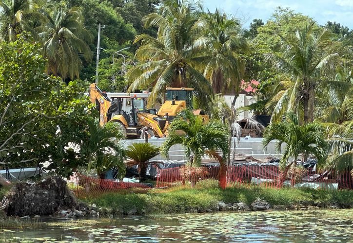 Workers pouring concrete for the roof of the military retreat building in Bacalar
