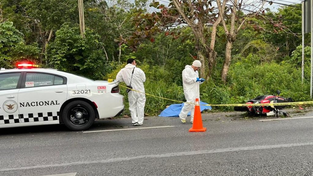 Emergency responders at the scene of a fatal hit-and-run accident near Cancun International Airport bridge