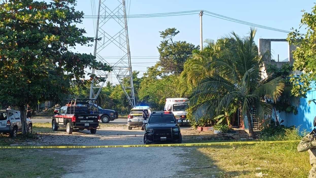 Police and emergency vehicles at the scene of a shooting outside La Palapa del Chocky bar in Cancún