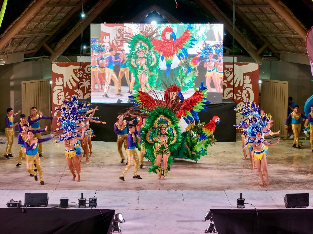 Crowd at a previous Cancún Carnival event with festive decorations