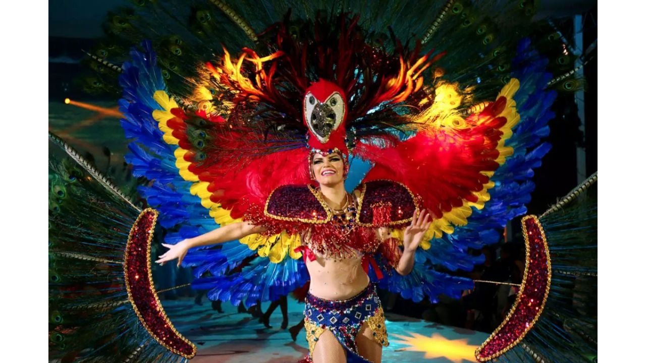 Colorful parade floats and dancers during a carnival celebration in Quintana Roo, Mexico