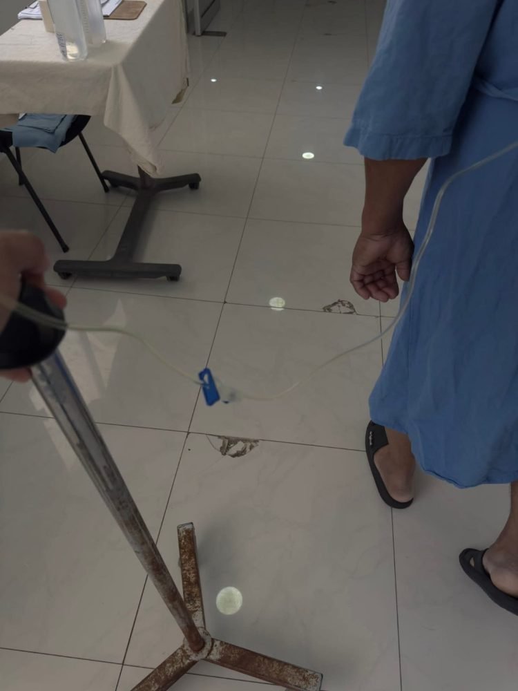Photograph showing damaged flooring with holes and uneven surfaces at Chetumal General Hospital