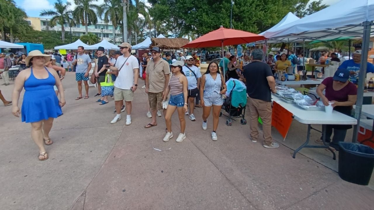 Attendees sampling ceviche dishes at the Cozumel Ceviche Festival in Benito Juarez Park
