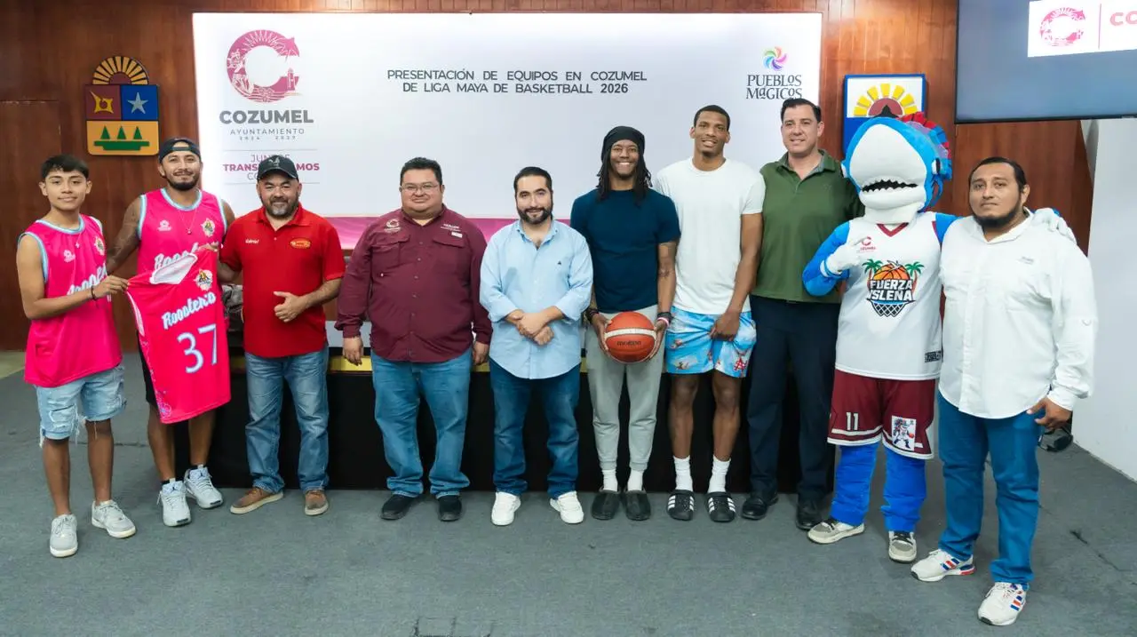 Local basketball teams Roosters de Cozumel and Fuerza Isleña pose for a photo during the announcement of the Poliforum renovation project