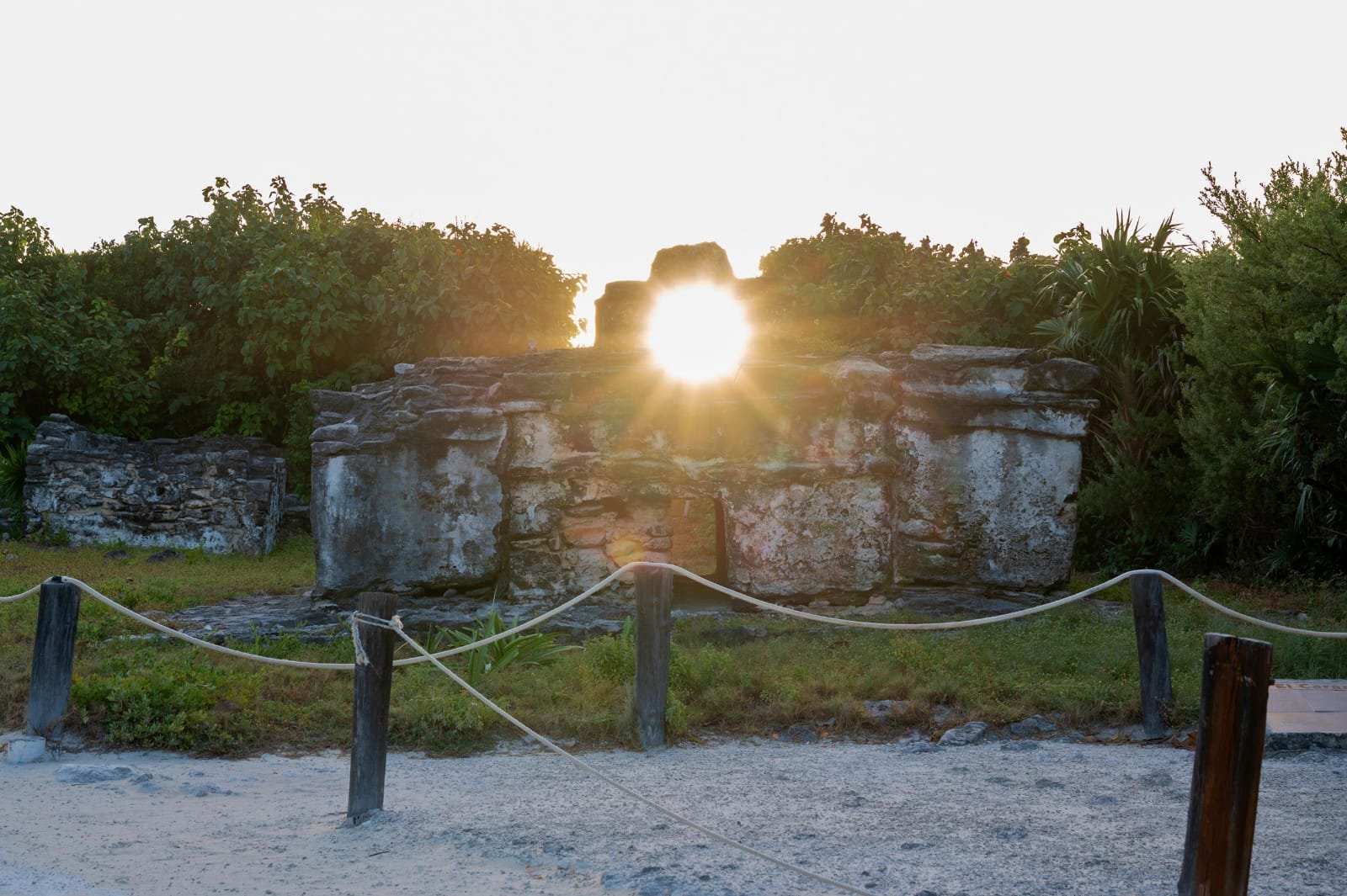 The El Caracol Maya archaeological site in Punta Sur, Cozumel, with sunlight streaming through its upper window during the winter solstice alignment.