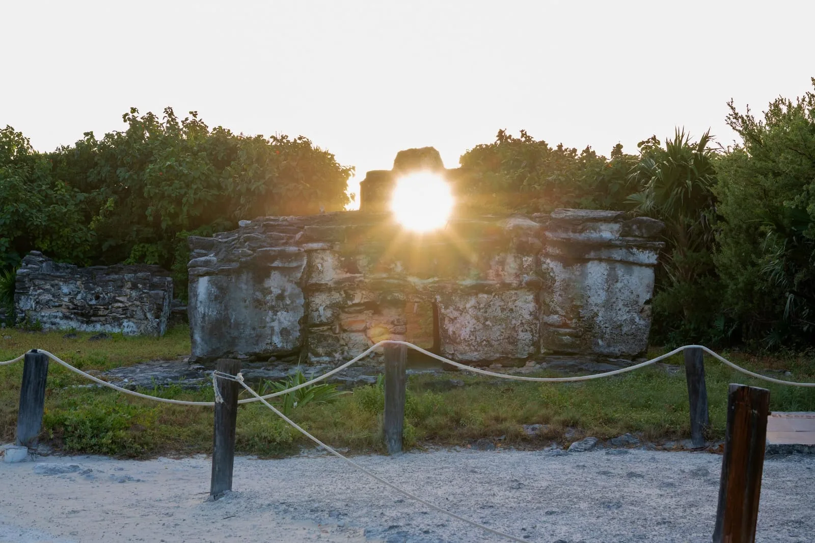 The El Caracol Maya archaeological site in Punta Sur, Cozumel, with sunlight streaming through its upper window during the winter solstice alignment.