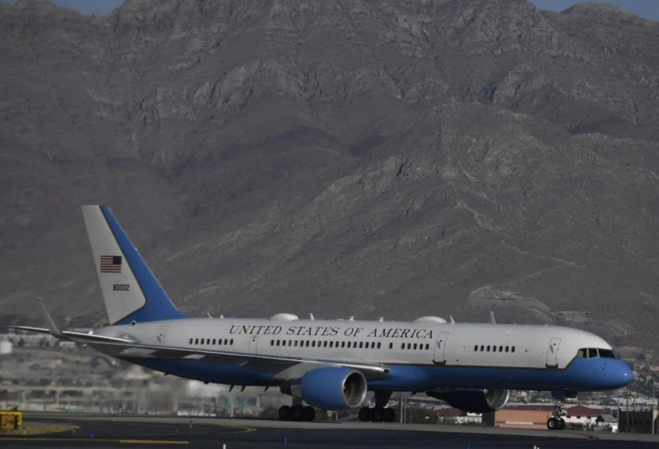 Aerial view of El Paso, Texas, with military aircraft in the background