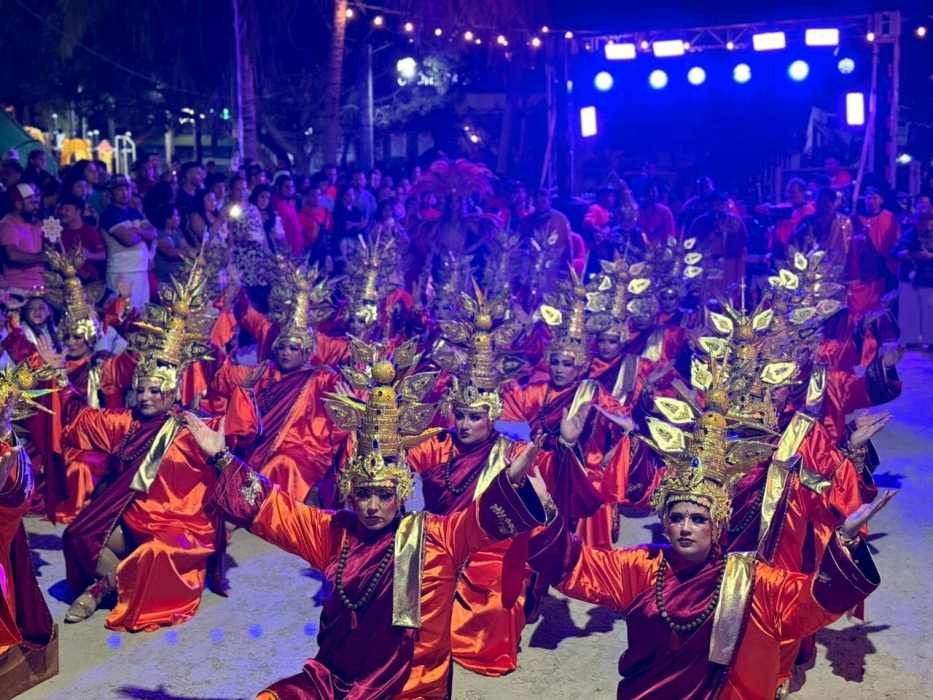Colorful parade participants in costumes during the Holbox Carnival in Mexico