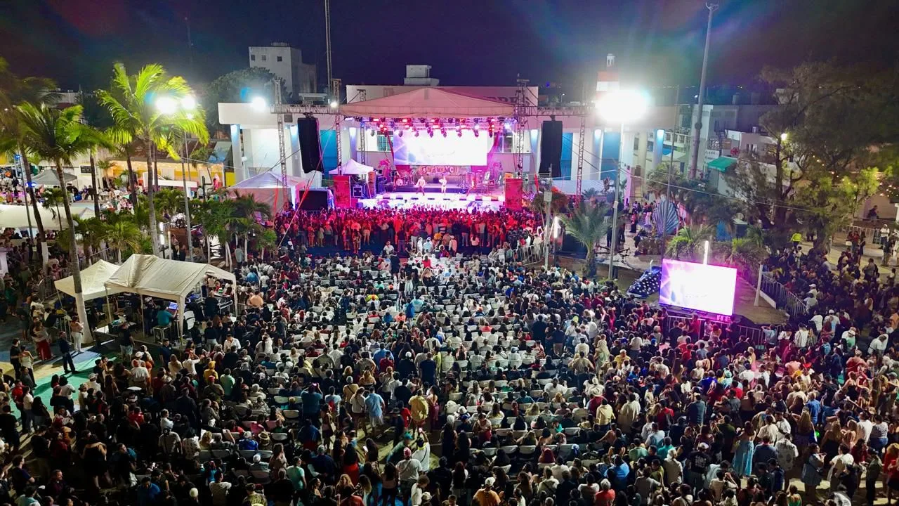 Performers in pirate-themed costumes dance on stage during the Isla Mujeres Carnival Pirate Night event.