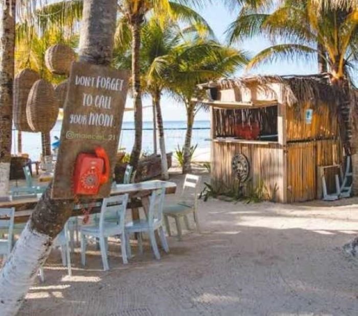 A conceptual image showing a security arch on the access road to Mahahual in Quintana Roo, Mexico