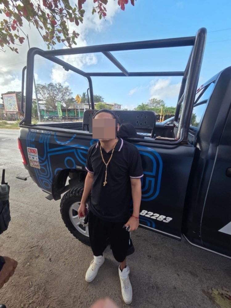 Police officers arresting a man in Playa del Carmen, Quintana Roo