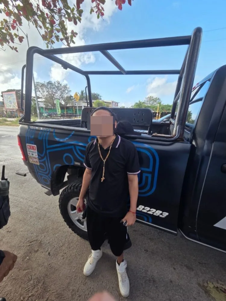 Police officers arresting a man in Playa del Carmen, Quintana Roo
