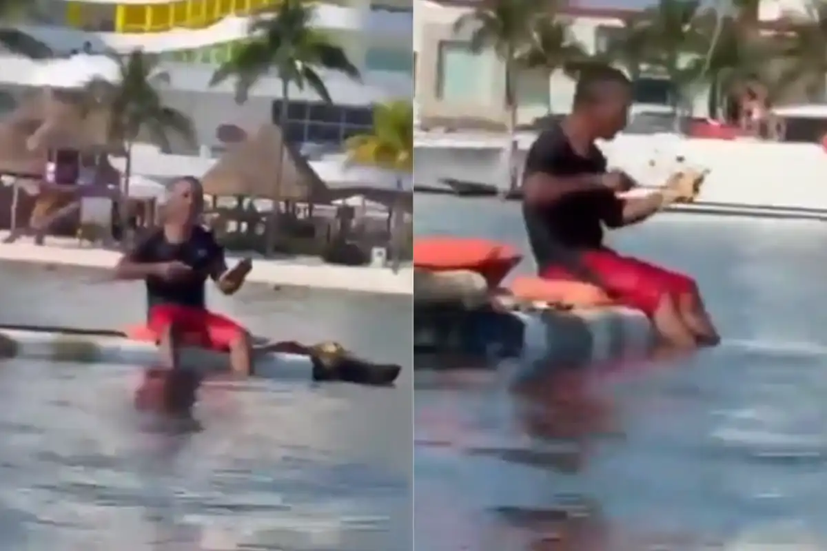 A man is seen illegally removing sea stars from the water in Cancún's Hotel Zone
