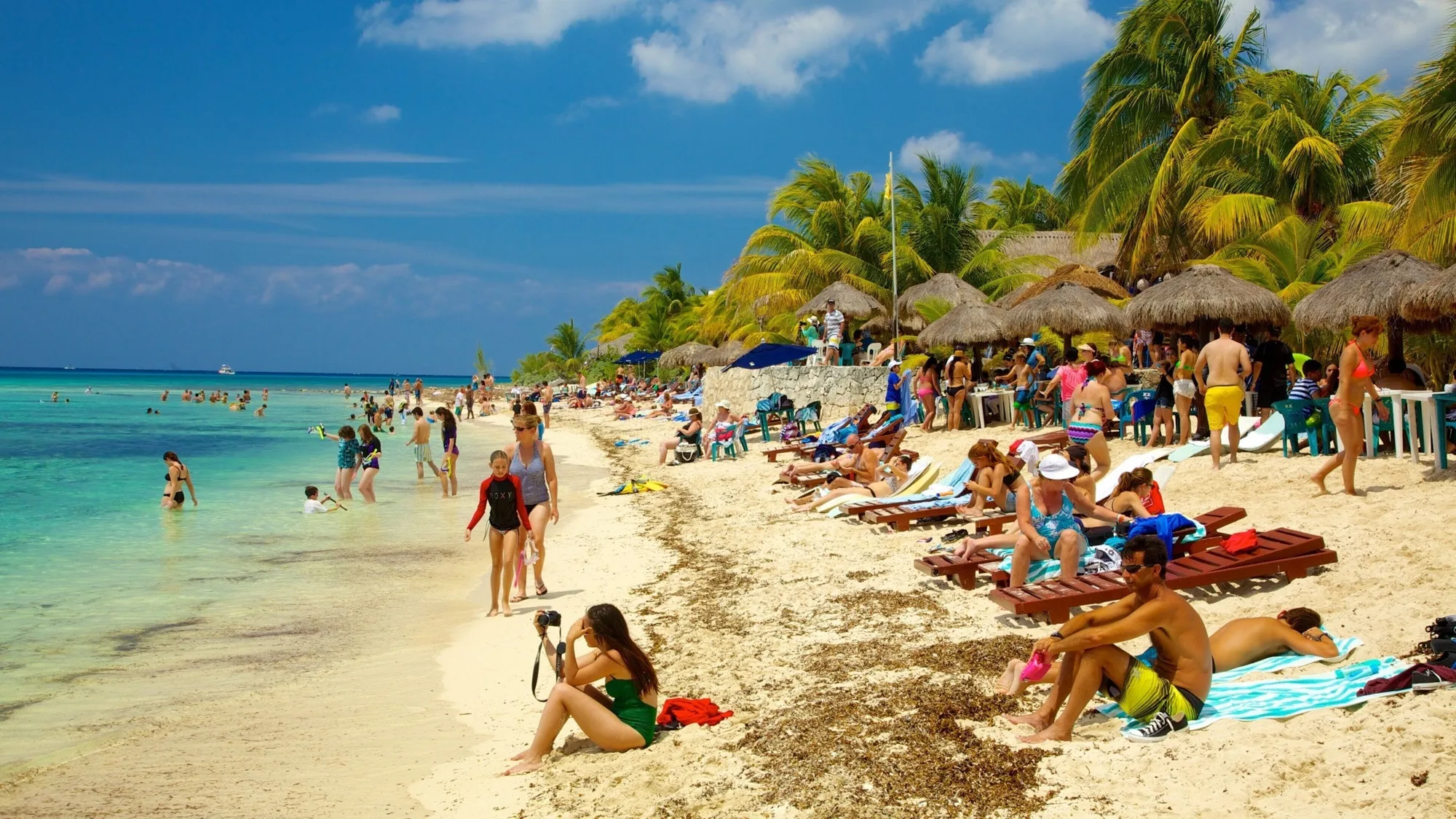 Aerial view of a beach in the Mexican Caribbean with turquoise water and white sand
