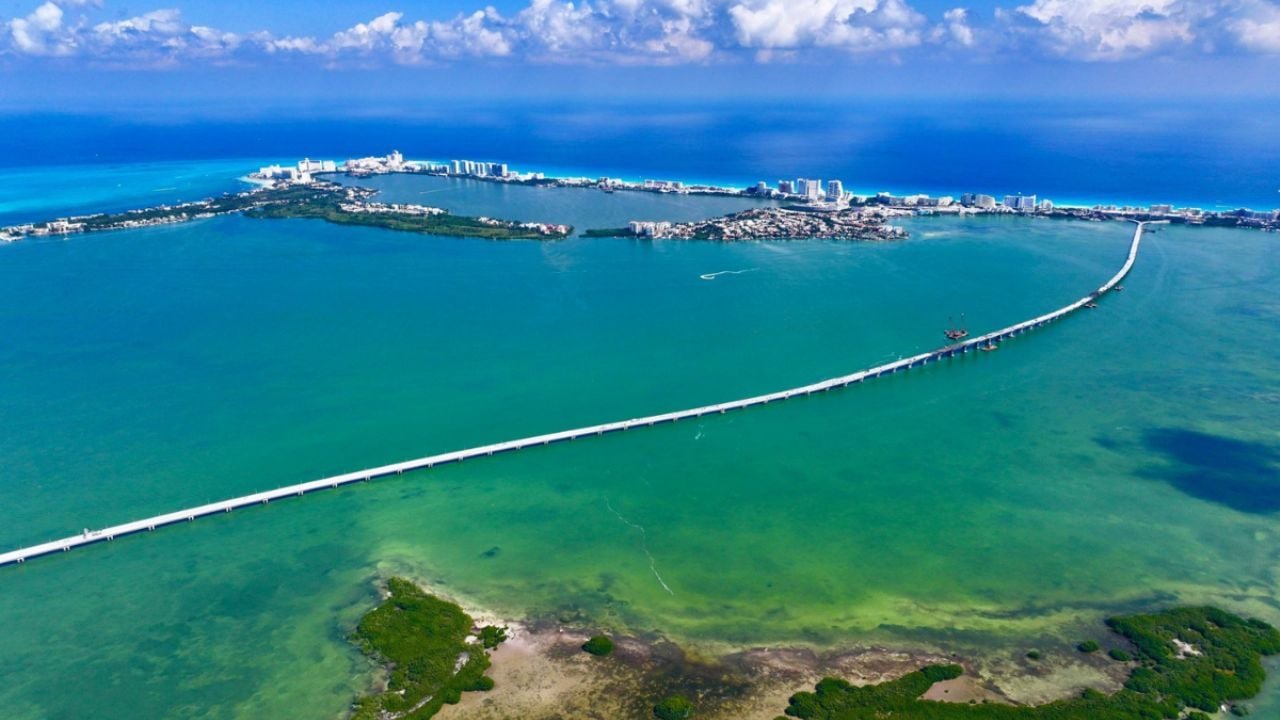 Aerial view of the nearly completed Nichupté Bridge spanning the Nichupté Lagoon in Cancún, Mexico