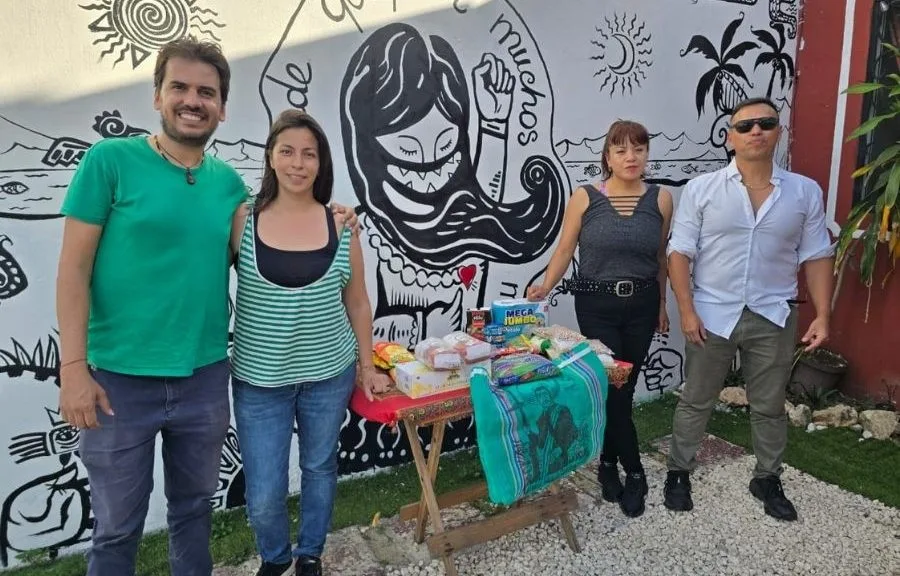 Volunteers collecting donations at Cafebrería Zapatista in Playa del Carmen for Cuba relief