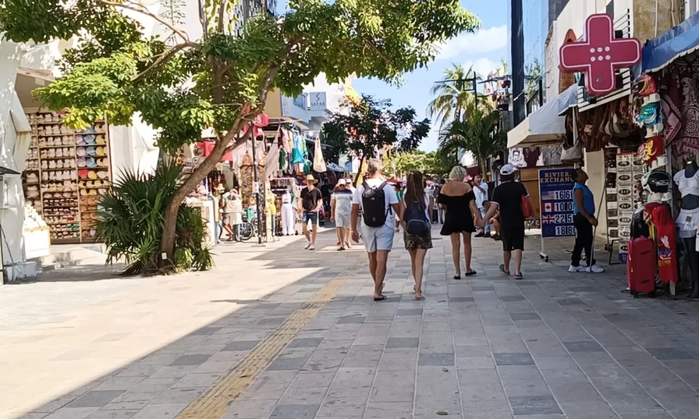 A street vendor at a tour kiosk in Playa del Carmen, Mexico