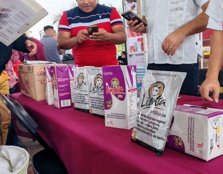 Dairy farmers in Quintana Roo preparing milk for collection at a new center in Othon P Blanco