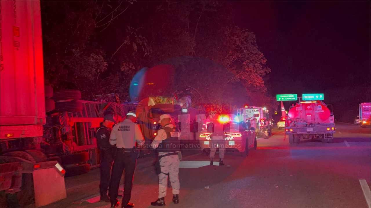 Emergency responders at the scene of a tractor-trailer rollover on a highway near Felipe Carrillo Puerto