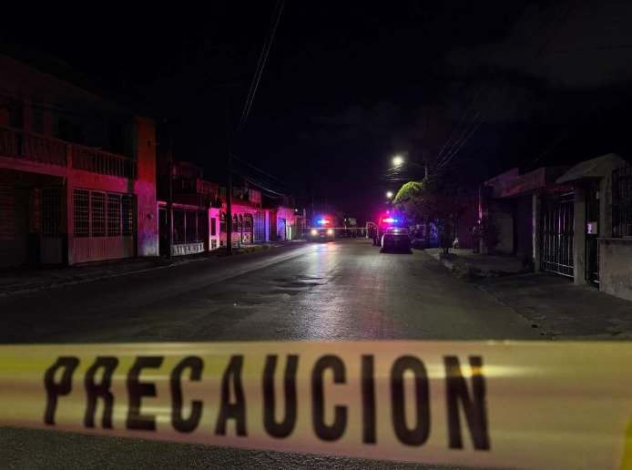 Police and emergency personnel at a crime scene in Tulum following a shooting