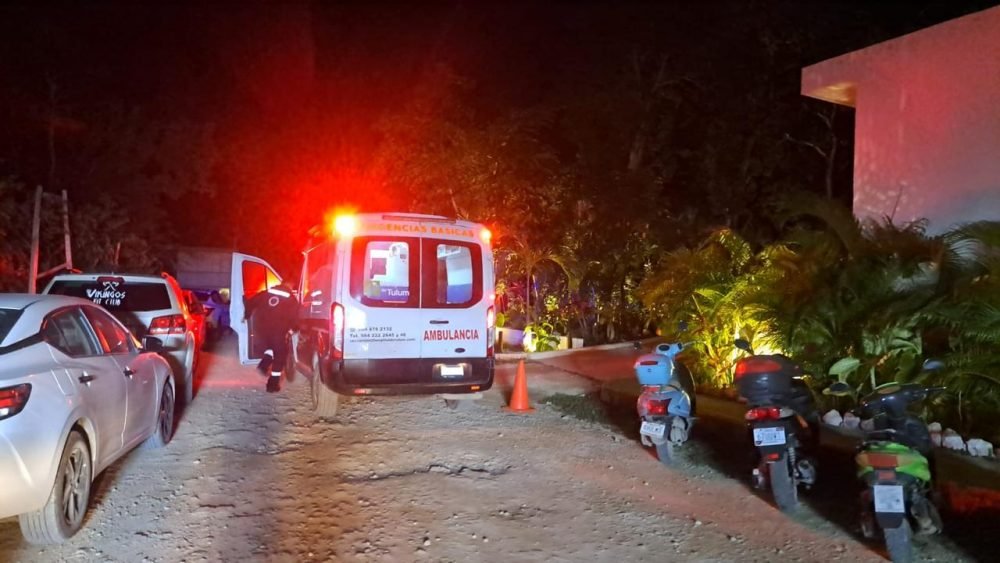 Police officers in Tulum arresting a suspect in a residential area
