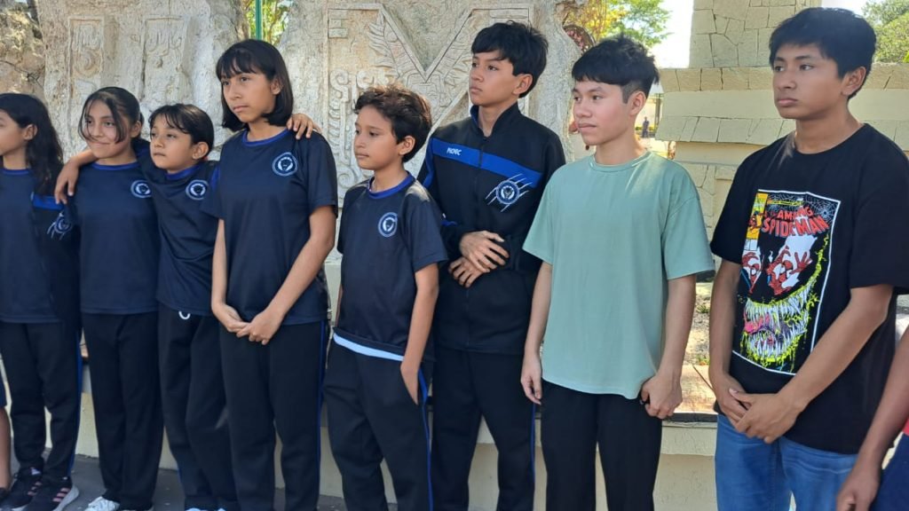 Tulum taekwondo athletes pose with coaches before traveling to Cancún for the state phase of the National Olympics