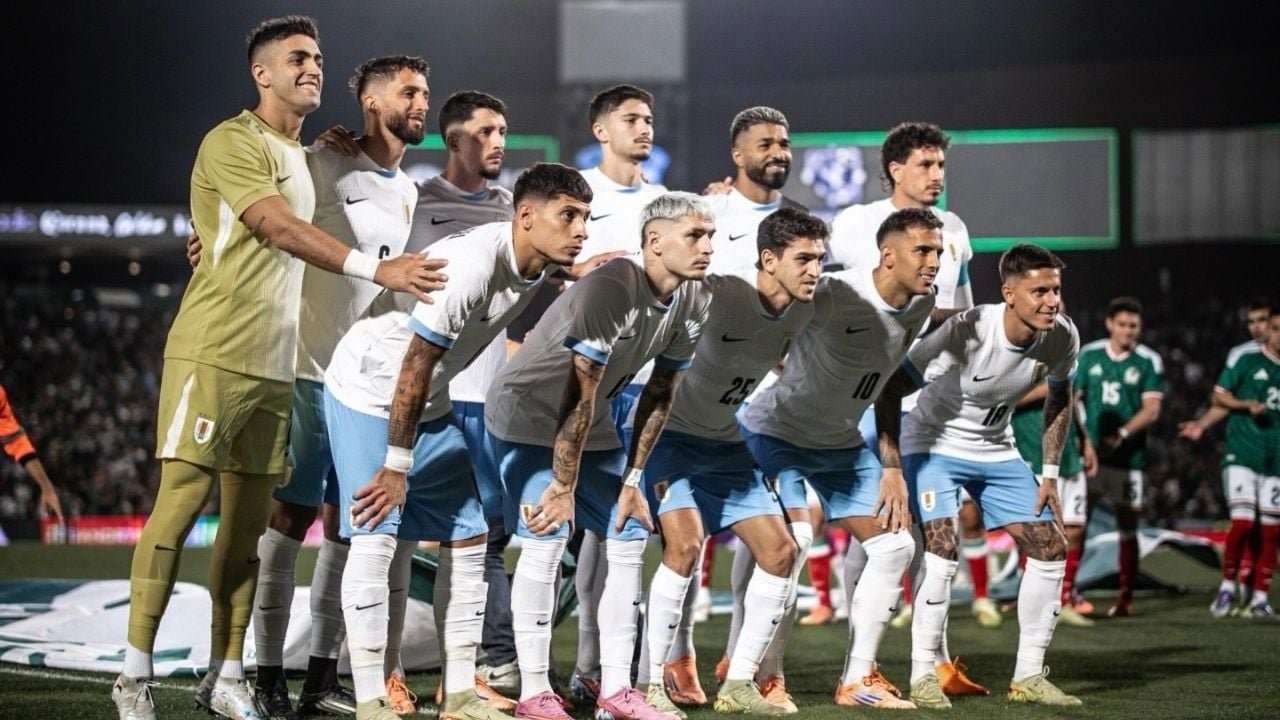 The Uruguay national football team during training, with security personnel visible in the background