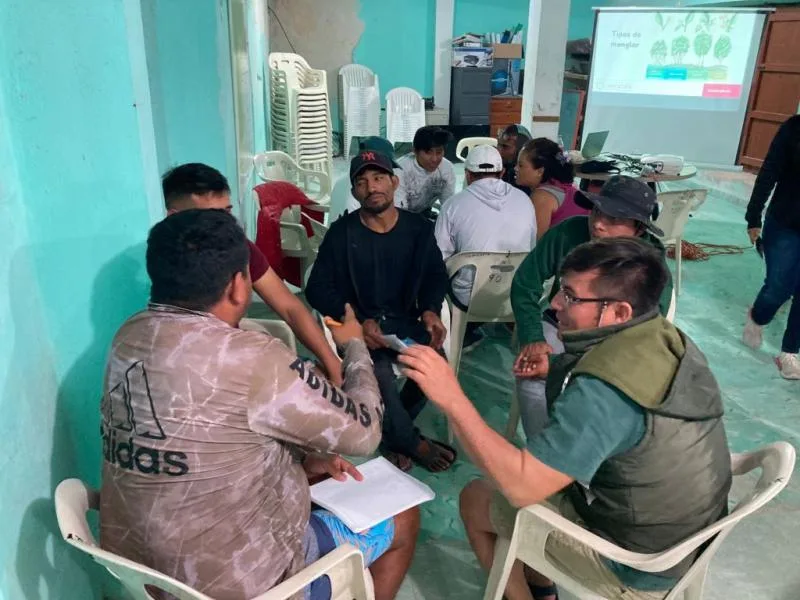 Tour guides participating in a mangrove ecology training session in Yucatan