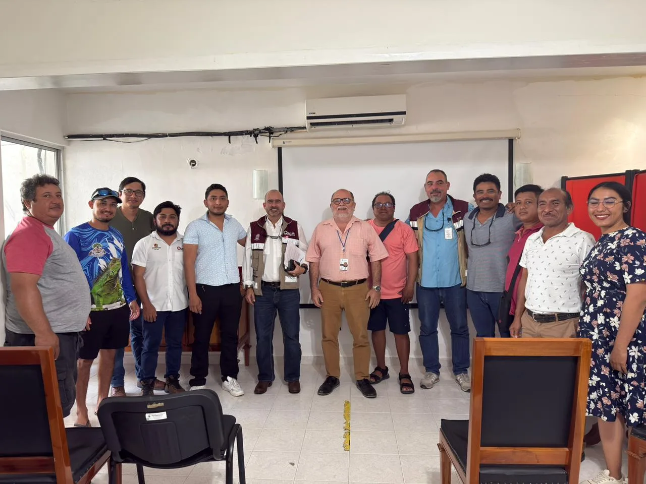 Officials and stakeholders at a meeting discussing blue crab fishing monitoring in Chetumal, Quintana Roo
