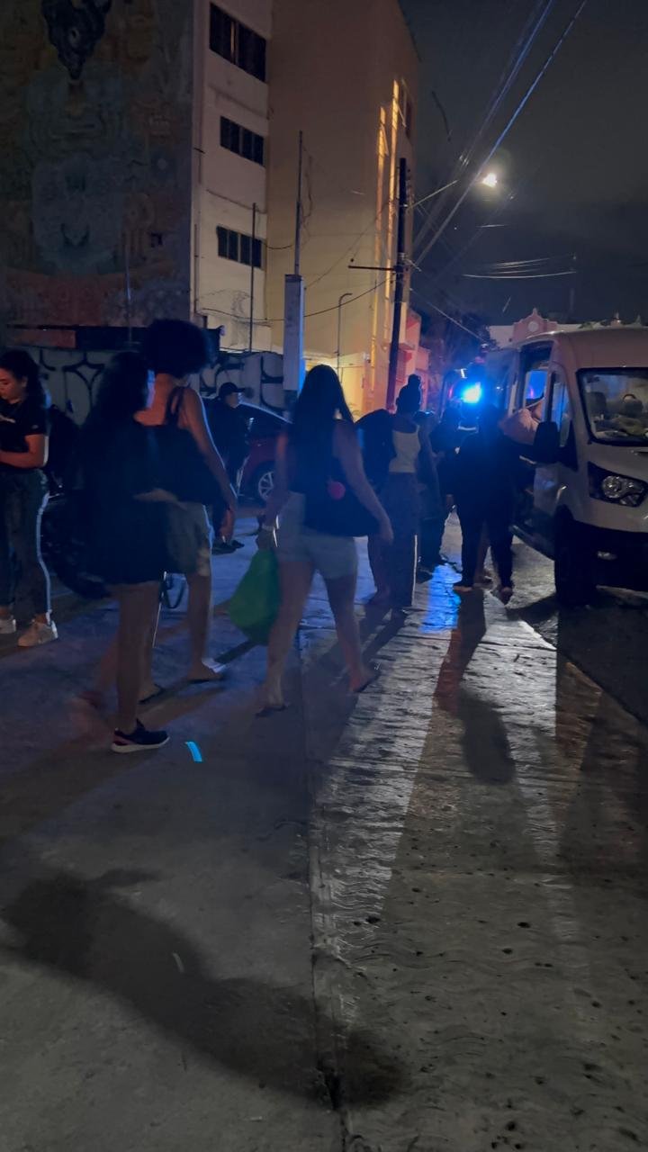 Police officers outside a bar in Cancún during a raid that rescued 39 alleged human trafficking victims