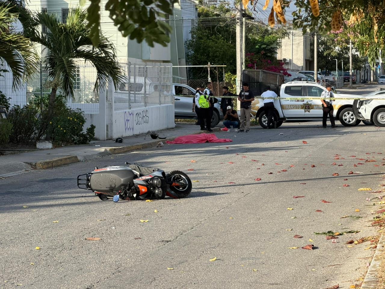 Emergency responders at the scene of a fatal motorcycle crash in Cancún