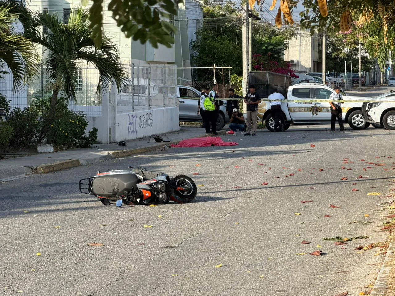 Emergency responders at the scene of a fatal motorcycle crash in Cancún