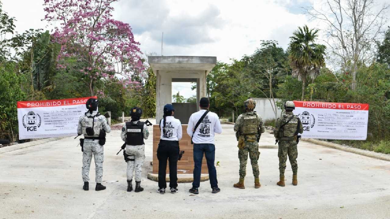 Aerial view of a real estate development site in Cancún, Mexico, showing cleared land and construction equipment