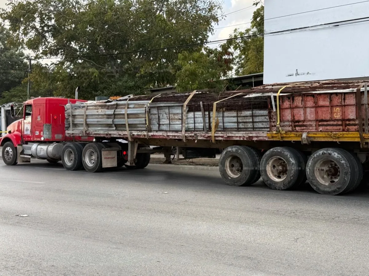 Emergency responders at the scene of a traffic accident in Cancun involving a tractor-trailer and a motorcycle