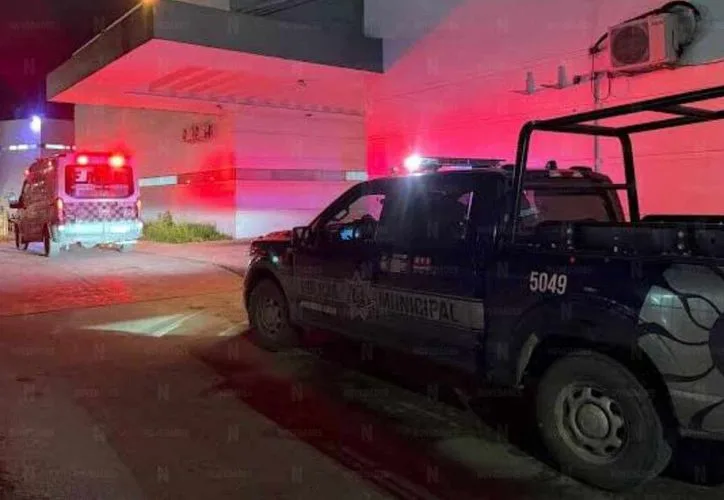 Police tape and emergency vehicles at the scene of a shooting at a car wash in Haciendas Real del Caribe, Cancún