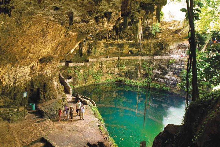 Aerial view of Cenote Zaci in Valladolid, Yucatan, showing turquoise waters and surrounding vegetation