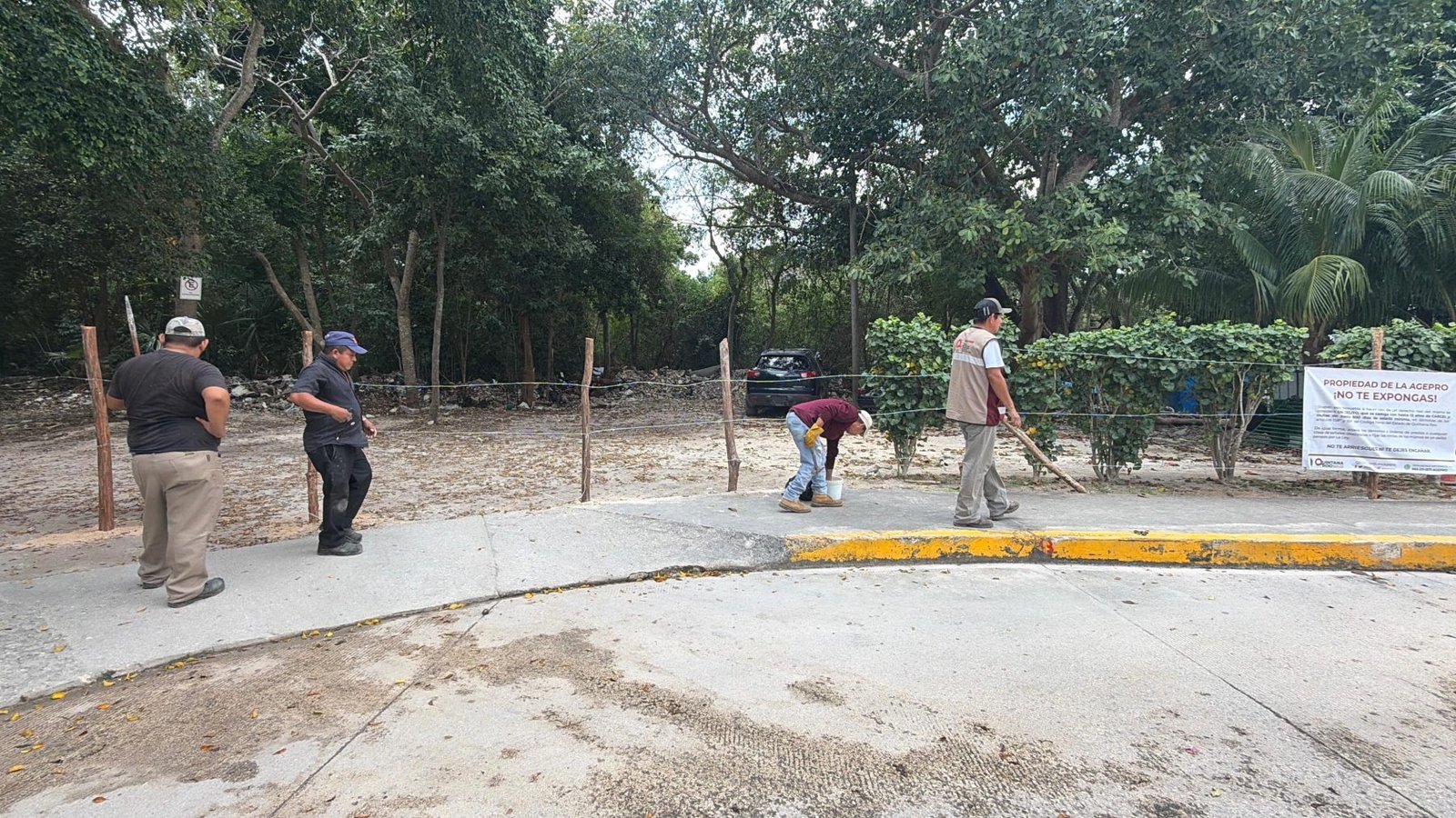 Residents of Chemuyil gather to protest the closure of a public access and parking area by state officials