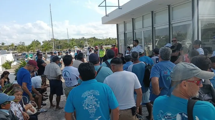 Tourism workers gathered at Cozumel Marina protesting new contracts