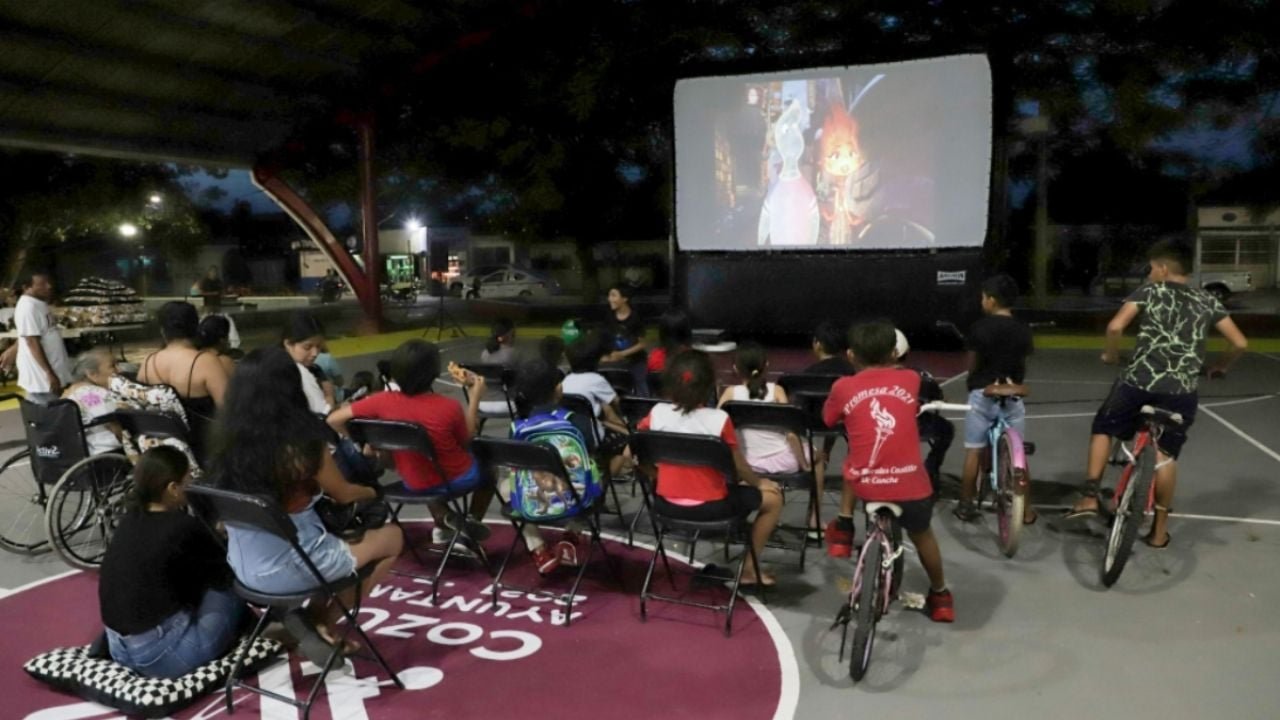 A family-friendly outdoor movie screening setup at Miraflores Park in Cozumel