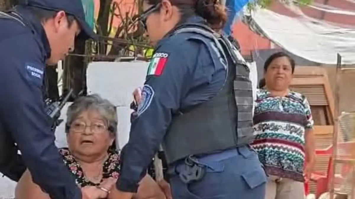 Two Cozumel police officers in uniform standing together