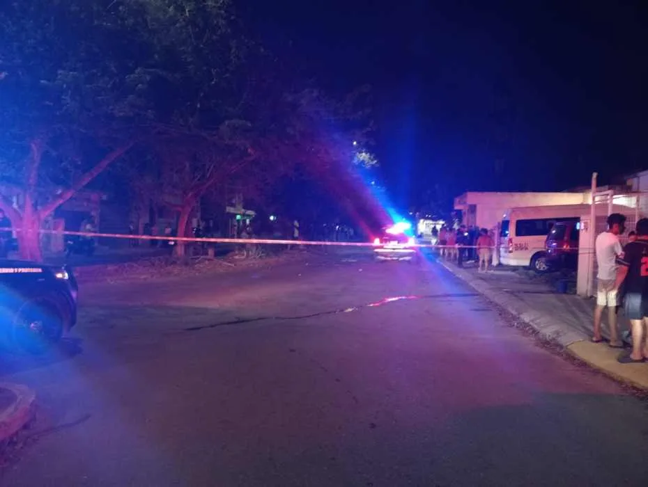 A vehicle with multiple bullet holes parked outside a house in Playa del Carmen's Palmas 2 neighborhood after a shooting attack.