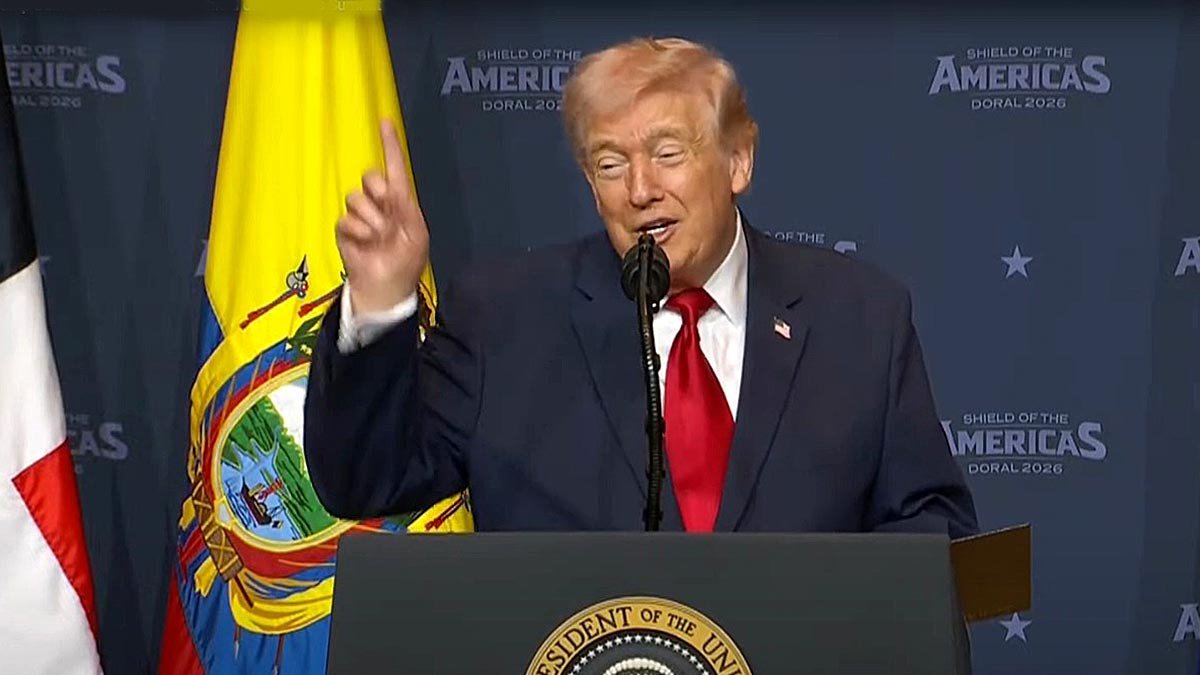 U.S. President Donald Trump speaking at a podium during the Americas Shield summit