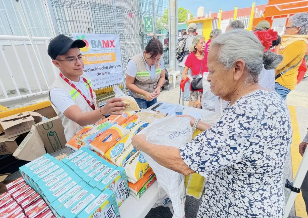 Food bank workers sorting and packing rescued food items in Quintana Roo