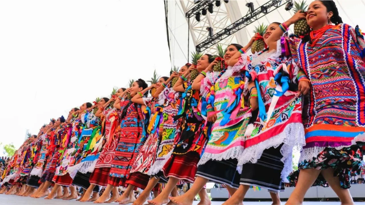 Performers in traditional Oaxacan dress at the Guelaguetza Riviera Maya festival in Playa del Carmen