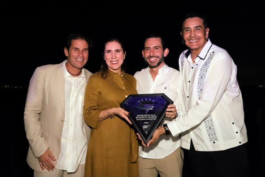 Impression Isla Mujeres by Secrets hotel exterior with Five Diamond award plaque