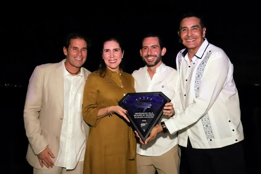 Impression Isla Mujeres by Secrets hotel exterior with Five Diamond award plaque