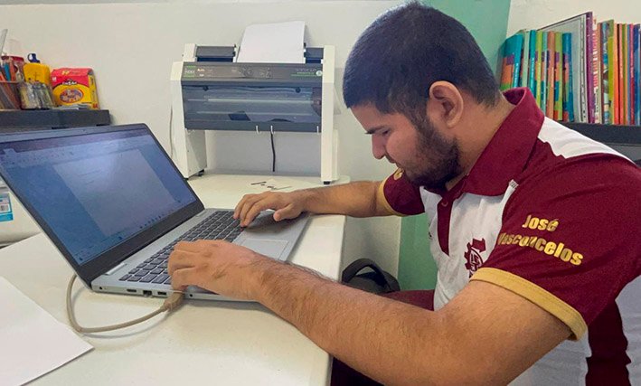 José Manuel Pech working with braille materials at his project in Cozumel, Quintana Roo