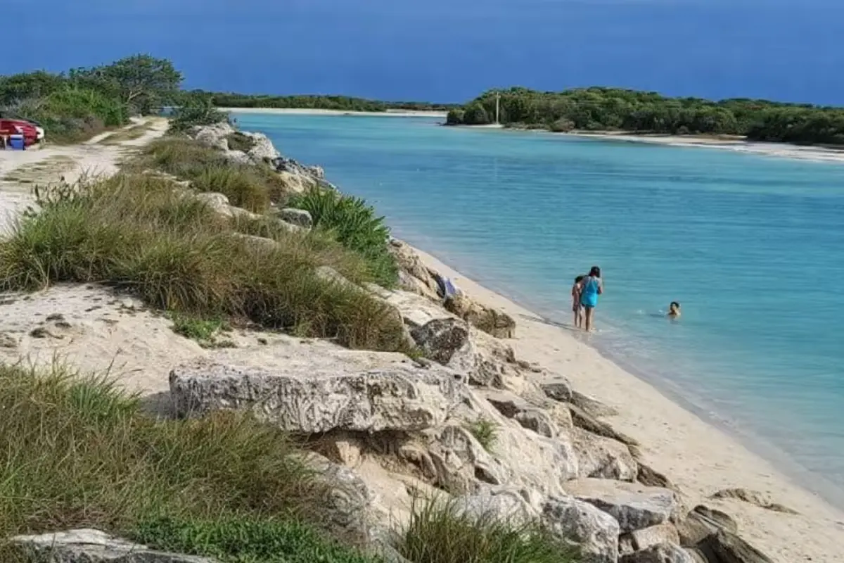 Aerial view of La Bocana beach in Chuburná Puerto, Yucatan, showing coastal waters with warning signs visible