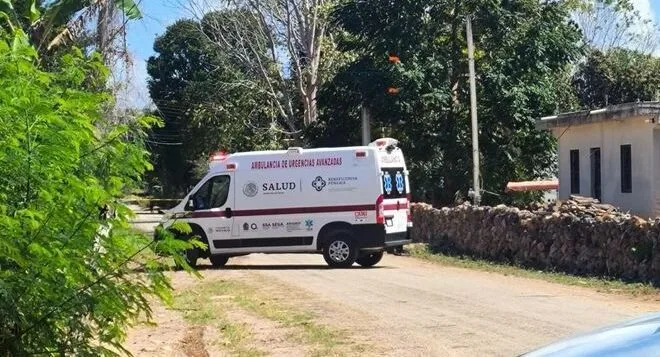 Police officers cordon off a street in Leona Vicario, Puerto Morelos, after a fatal shooting